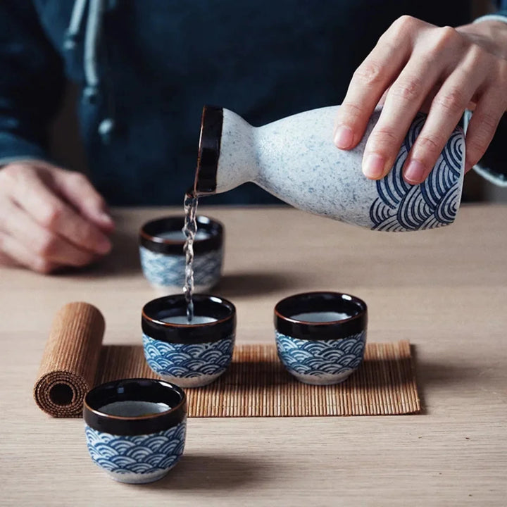 Blue Wave Ceramic Sake Set pouring lifestyle