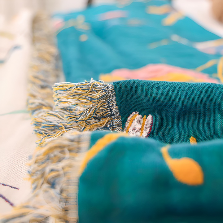Boho Bird Print Cotton Throw fringe and weave close-up
