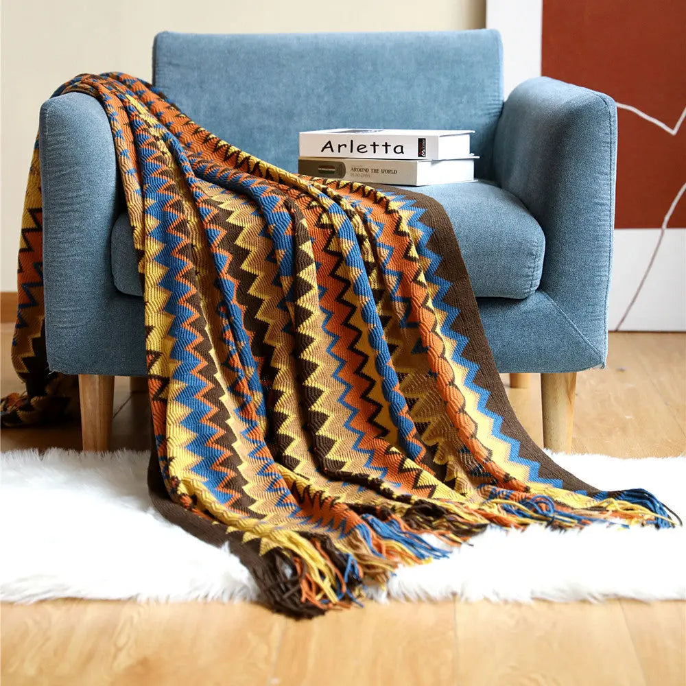 Multicolor Boho Chevron Knit Throw Blanket draped on sofa