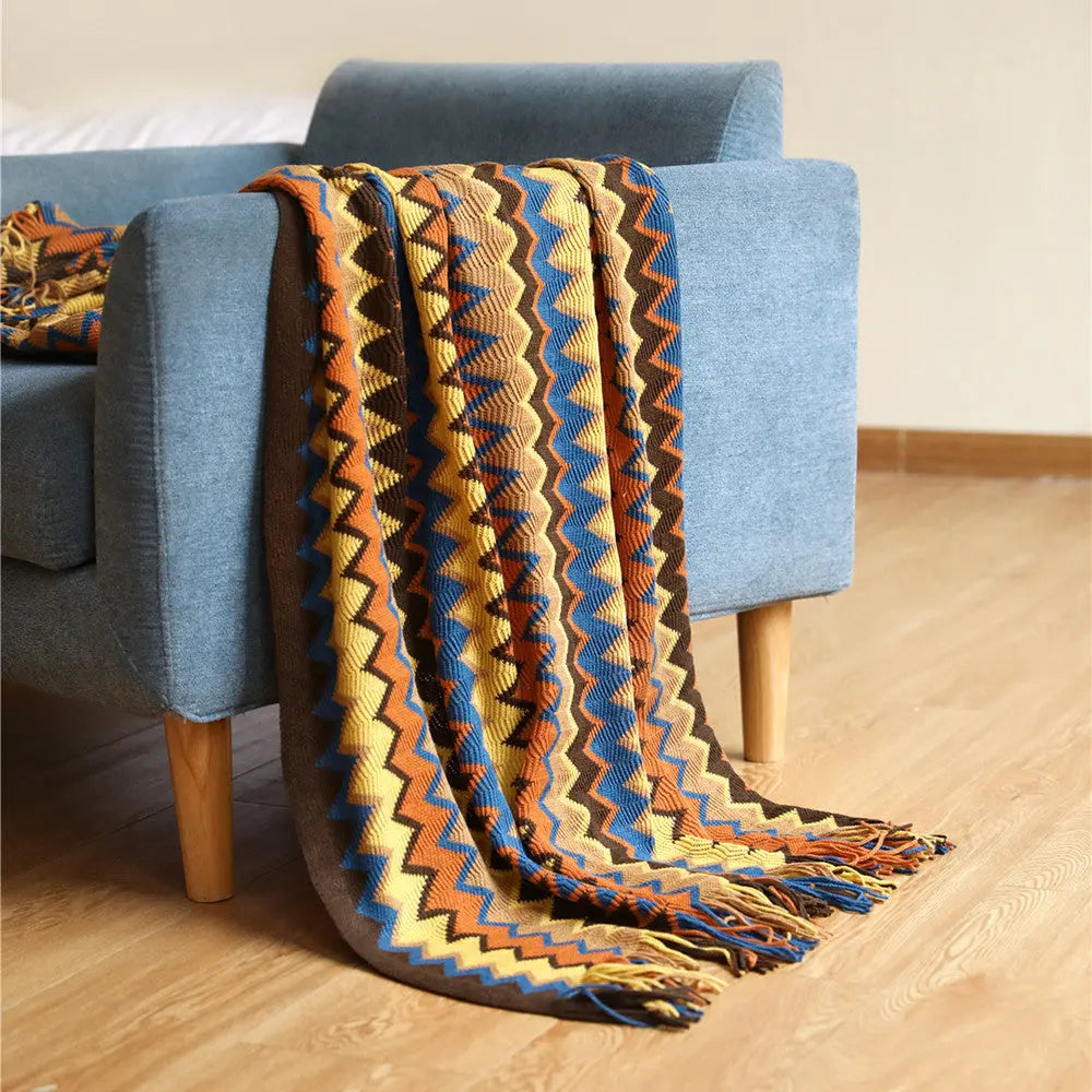 Multicolor Boho Chevron Knit Throw Blanket over armchair