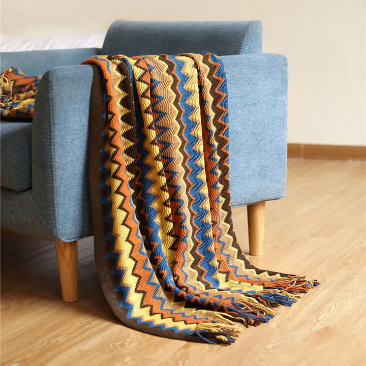 Multicolor Boho Chevron Knit Throw Blanket over armchair