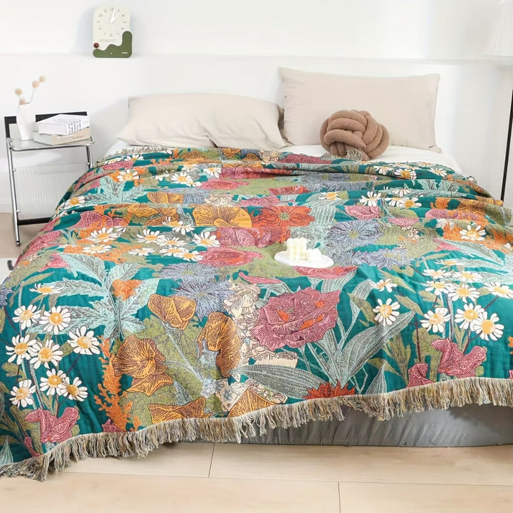 Boho Floral Tasseled Throw Blanket spread on bed