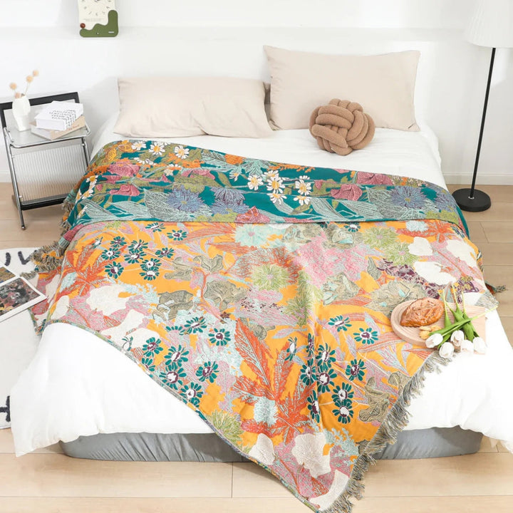 Boho Floral Tasseled Throw Blanket reverse side on bed