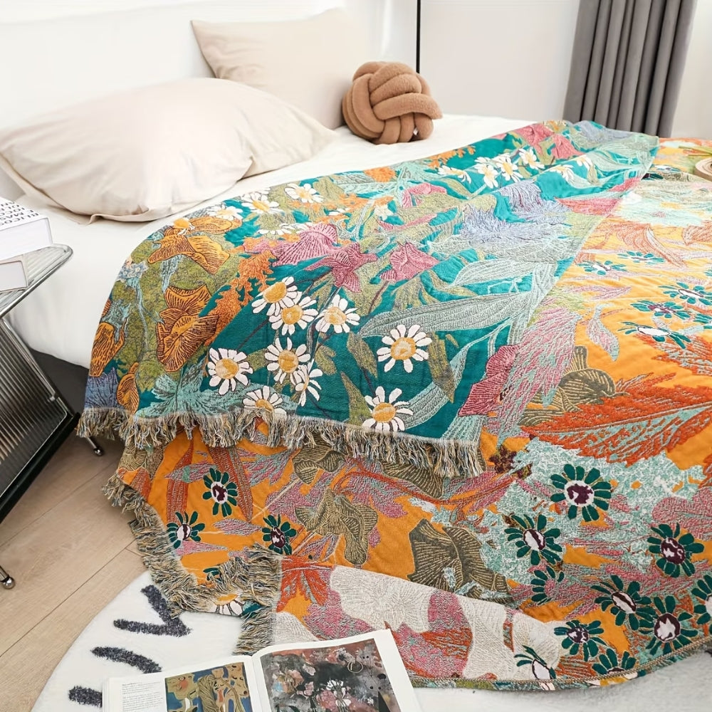 Boho Floral Tasseled Throw Blanket draped over bed corner