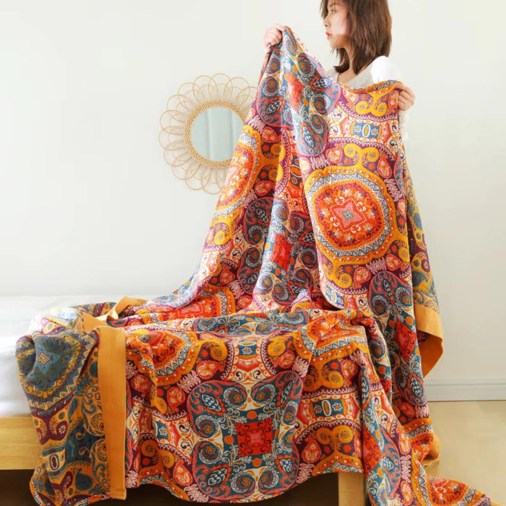 Boho Medallion Cooling Cotton Throw held open in a bedroom