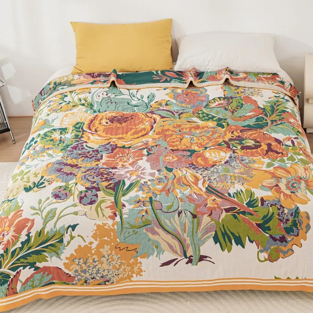 Bordered Floral Jacquard Cotton Throw spread across a bed