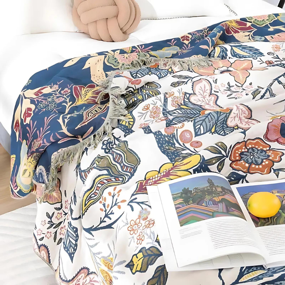 Blue botanical print cotton throw blanket fabric texture close-up