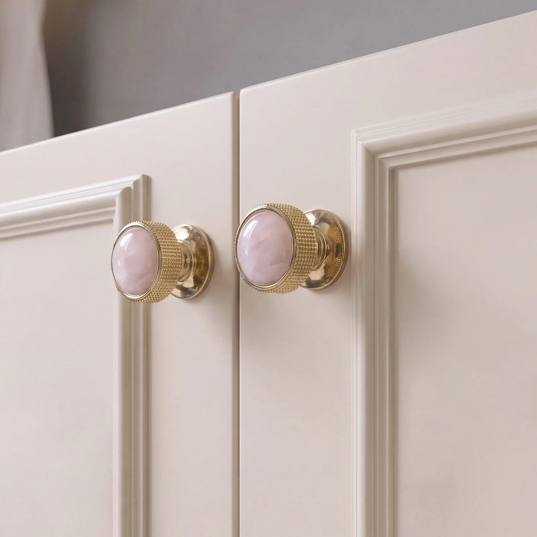 Pink Quartz Brass Cabinet Knobs installed on cabinet doors