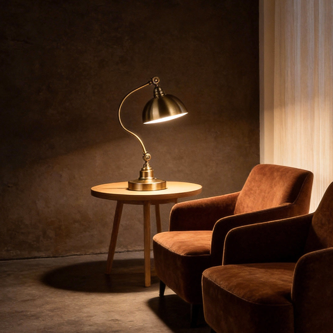 Bronze Gooseneck Task Light illuminating a cozy reading corner