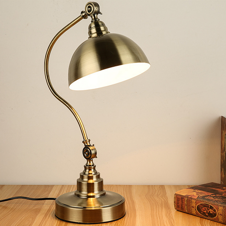 Bronze Gooseneck Task Light standing on a wood desk