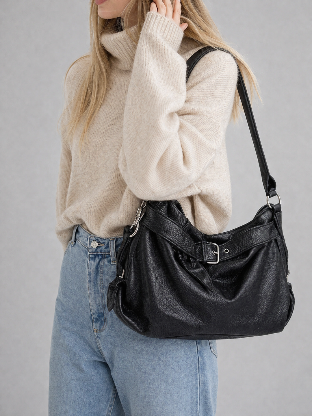 Black Buckle-Strap Vegan Leather Hobo Bag lifestyle with knit sweater