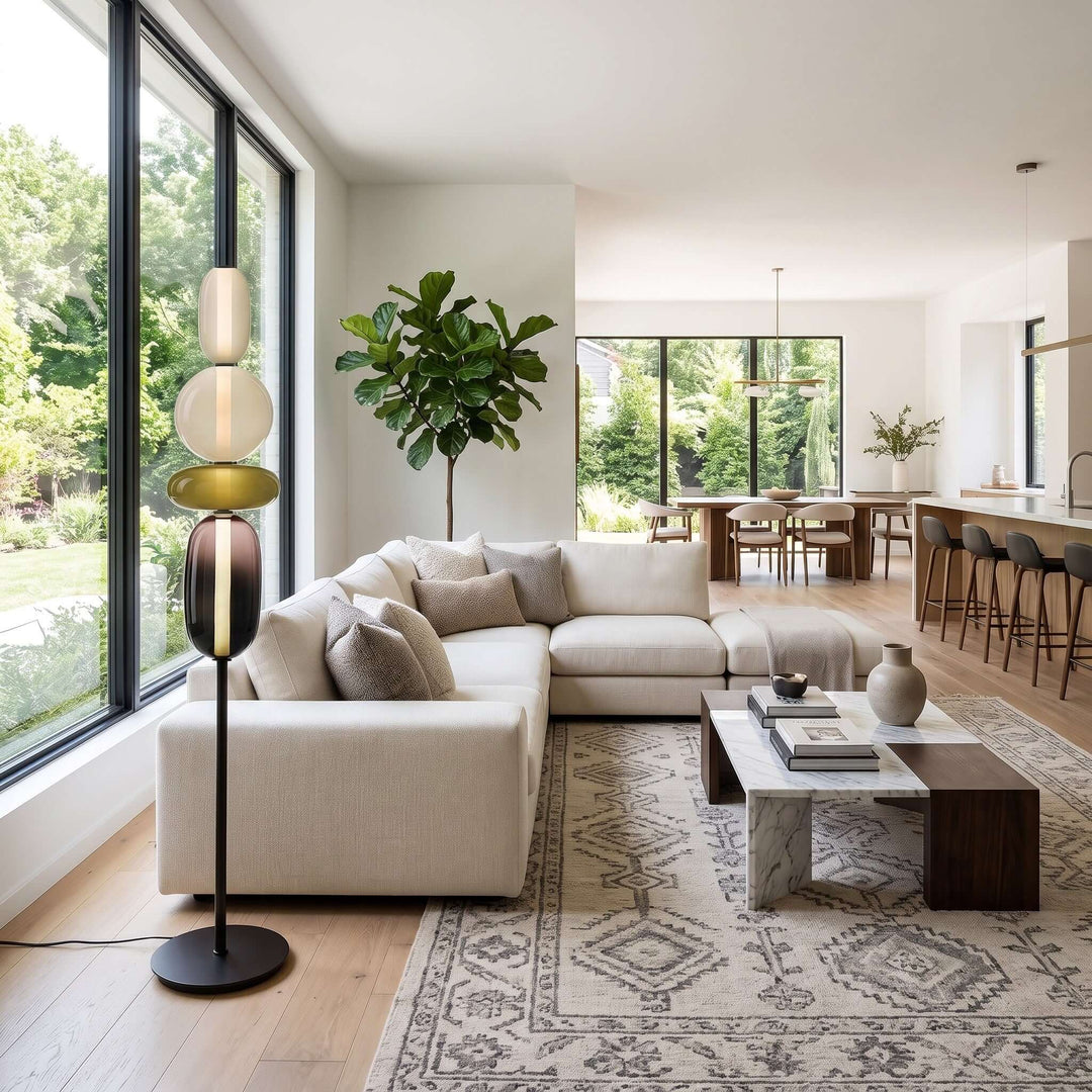 Green Candied Glass Floor Lamp beside a white sectional sofa in a bright living room