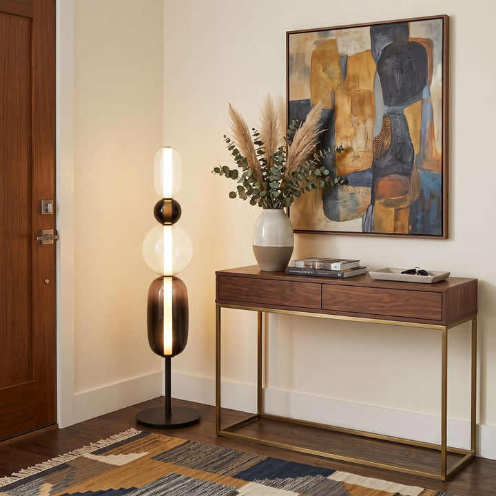 Black Candied Glass Floor Lamp Model B beside a walnut console in an entryway