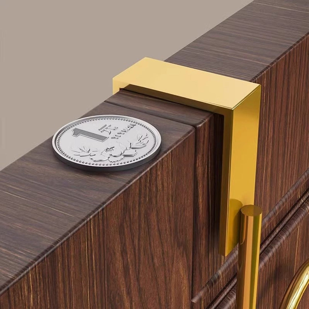 Gold over-door coat rack hook detail on a door frame
