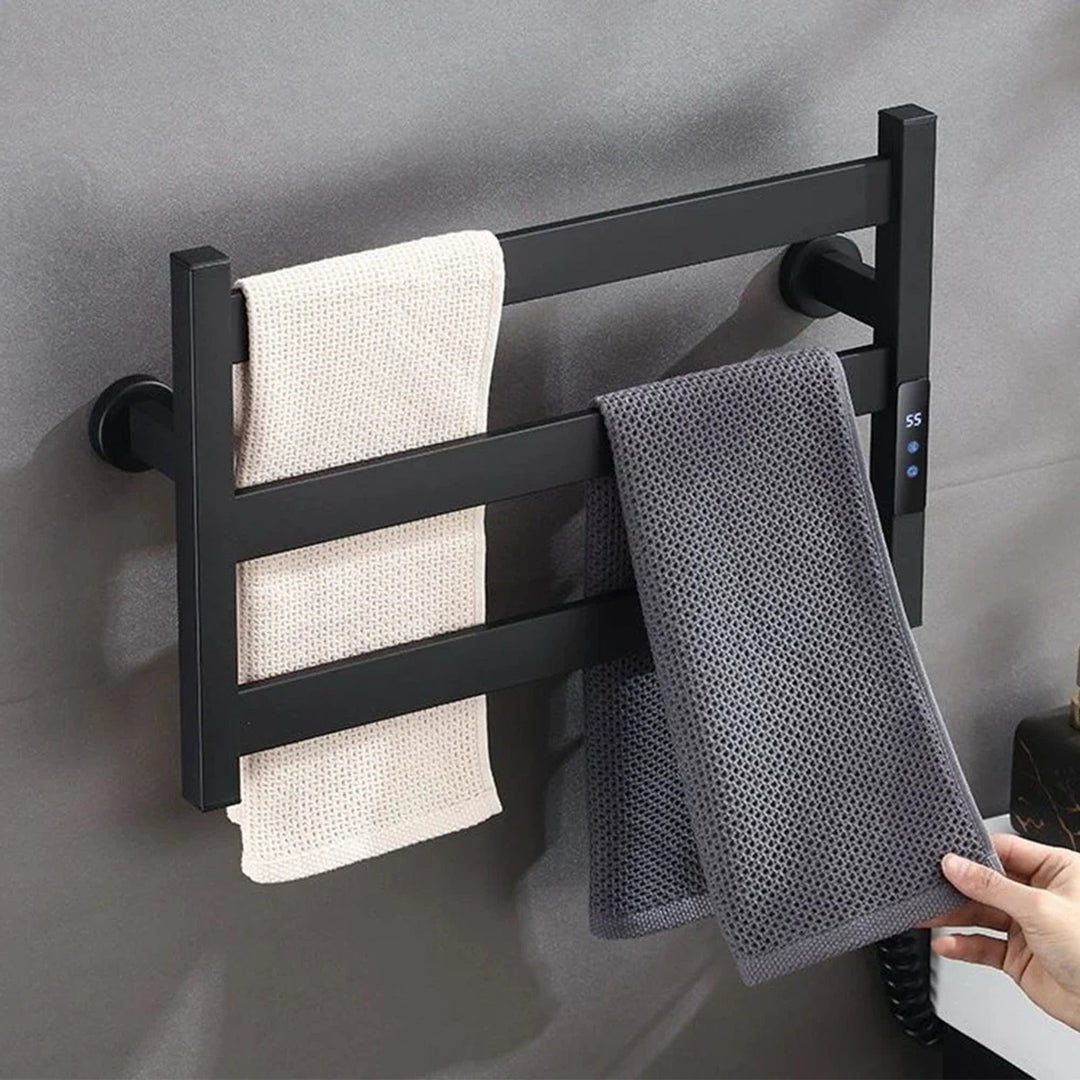 Towel being placed on a black heated towel rack