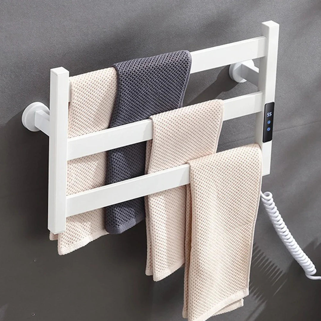 White three-bar heated towel rack holding towels