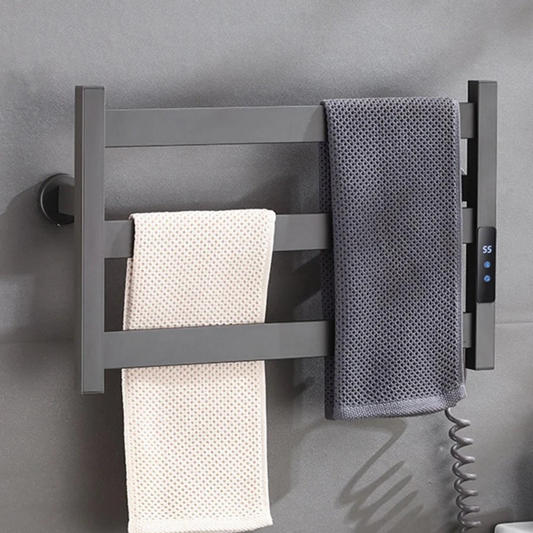 Three-bar heated towel rack holding folded towels