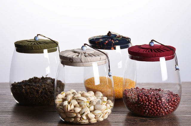 Corked Glass Tea Canister filled with tea leaves lifestyle