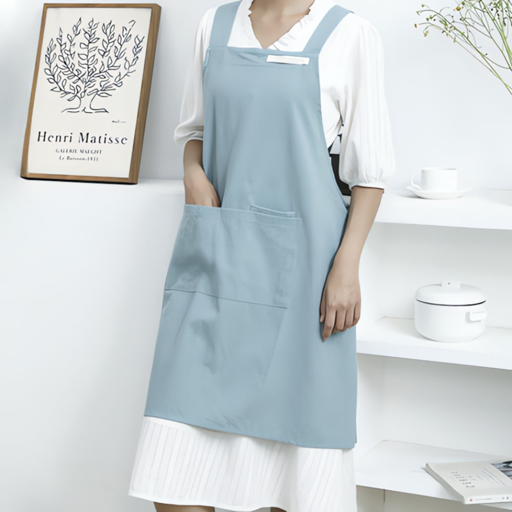 Sky Blue Cotton Cross-Back Apron worn in kitchen