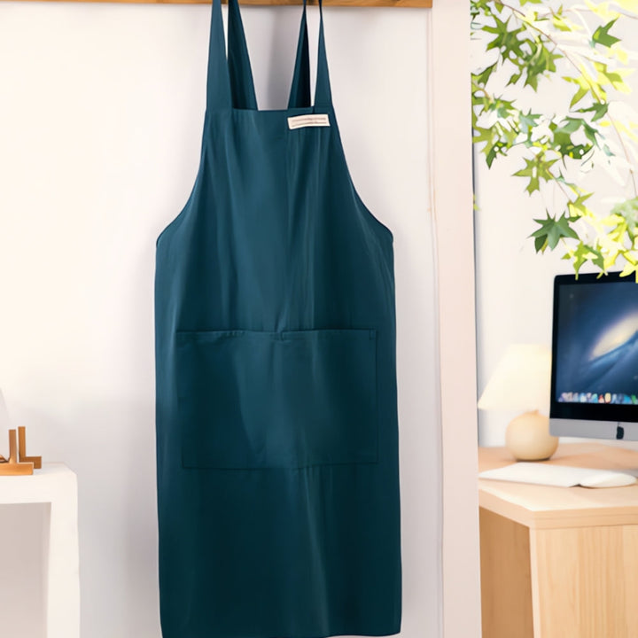 Teal Blue Cotton Cross-Back Apron hanging front view