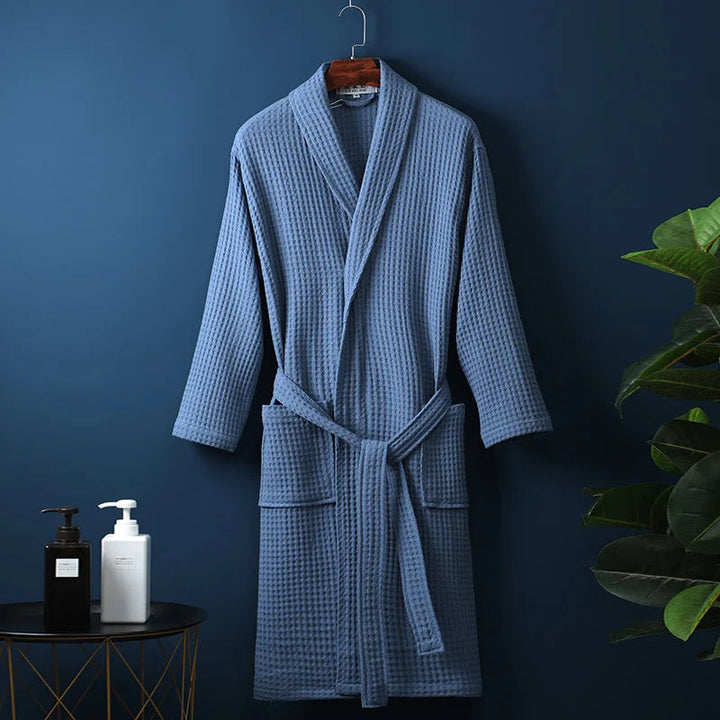 Blue Cotton Shawl-Collar Bathrobe on a hanger, front view
