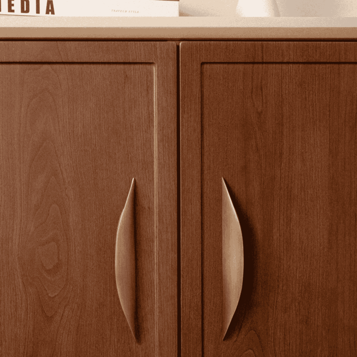 Crescent Brushed Brass Cabinet Pulls on wood cabinet doors