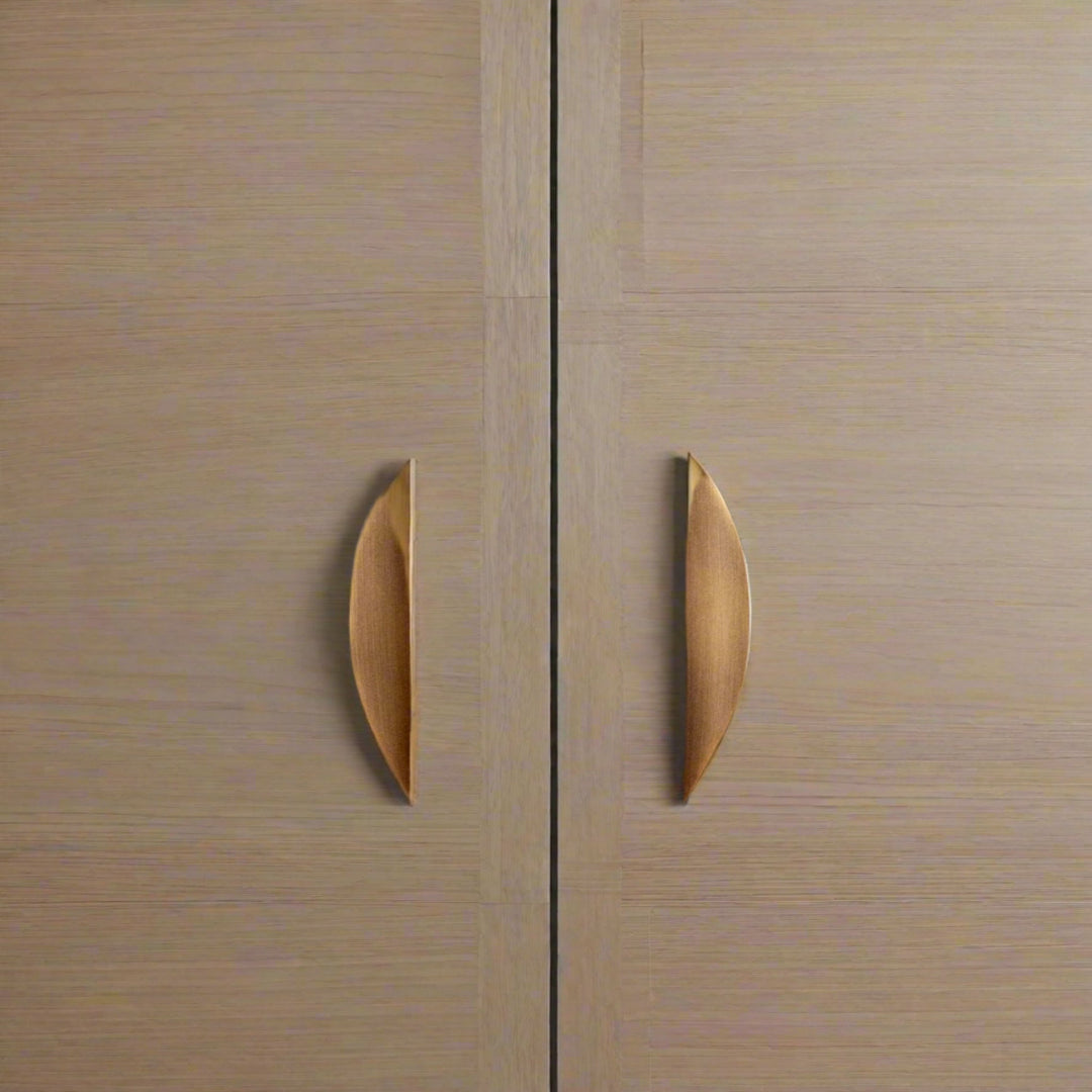 Crescent Brushed Brass Cabinet Pulls on light oak doors