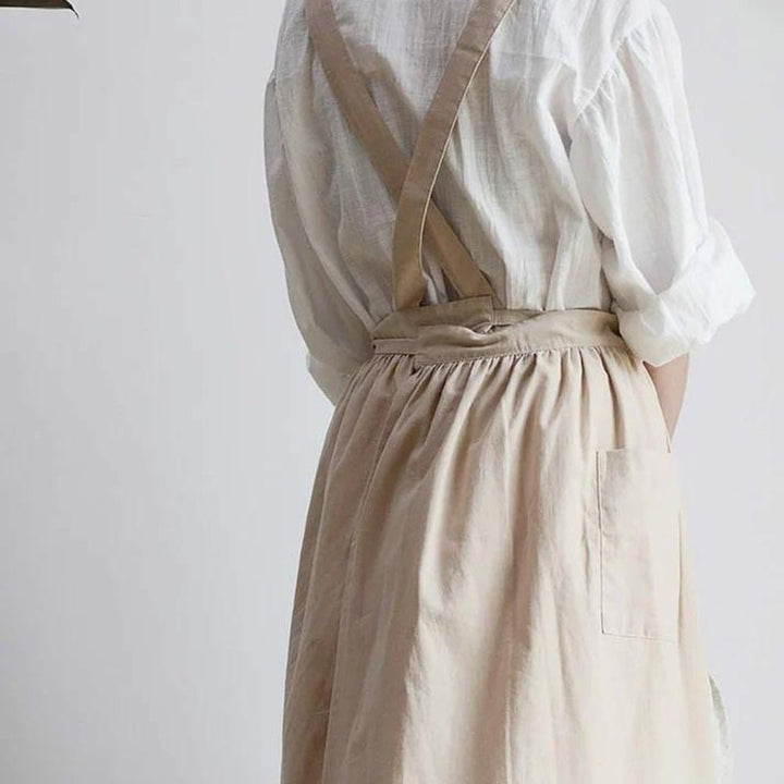 Cross-Back Cotton Kitchen Apron worn while cooking