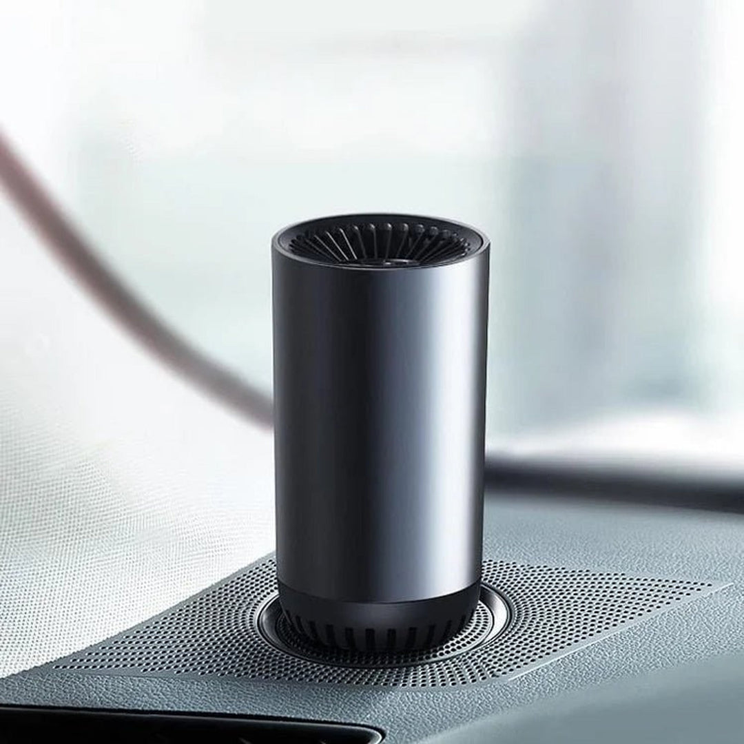 Cup-shaped car heater and fan on a car console