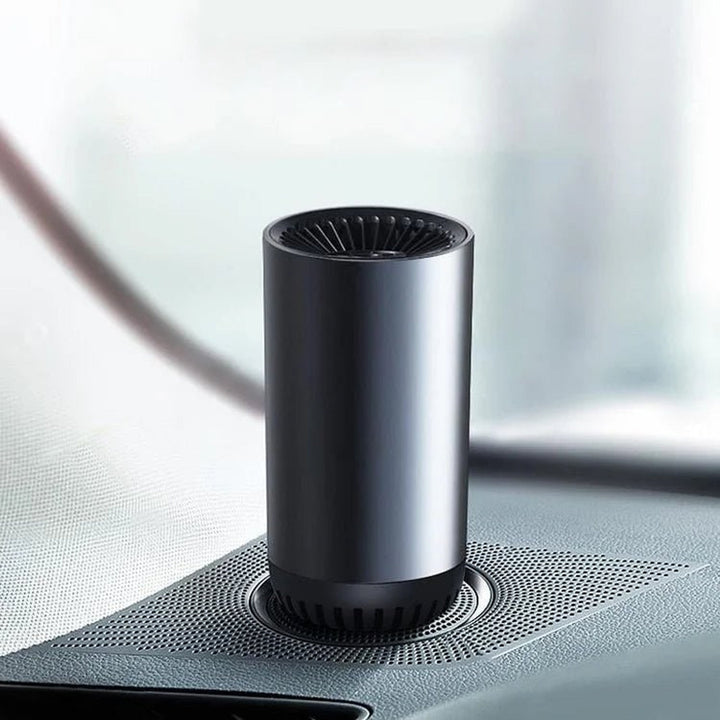 Cup-shaped car heater and fan on a car console