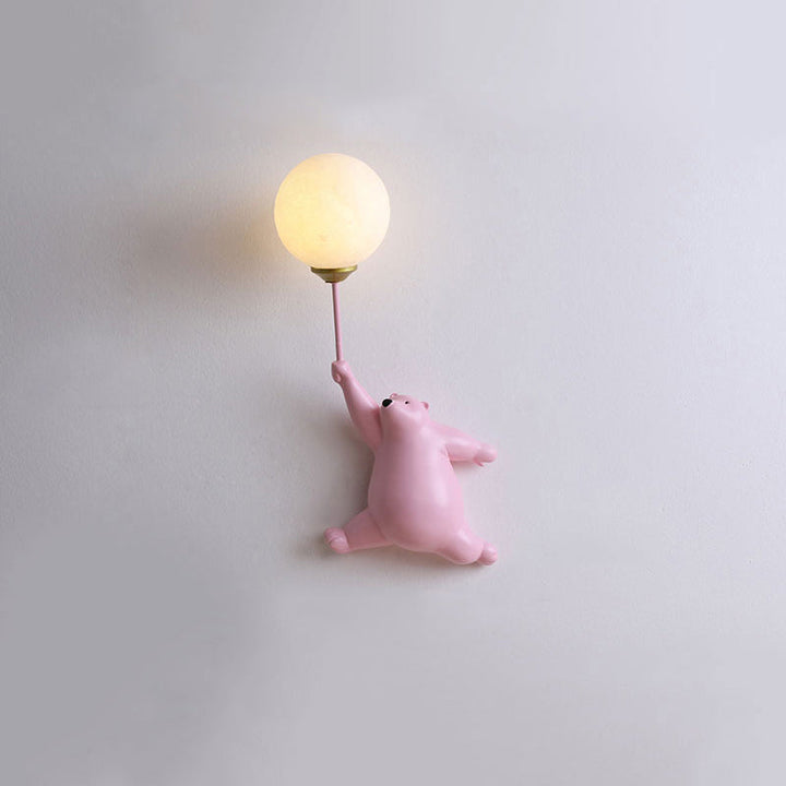 Blue Resin Bear Balloon Wall Lamp lit at night