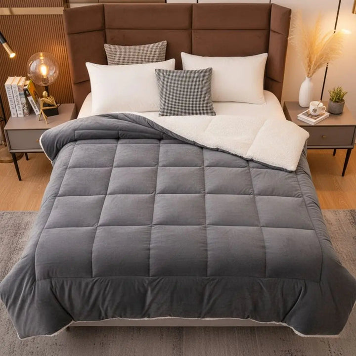 Gray Double-Sided Velvet Quilted Comforter on bed front view