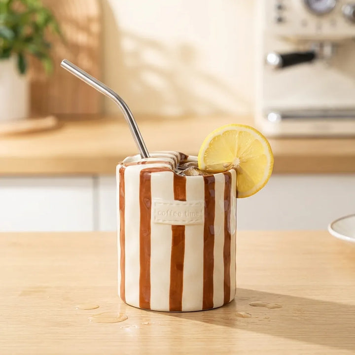 Brown Retro Striped Ceramic Mug with iced drink, straw, and lemon slice