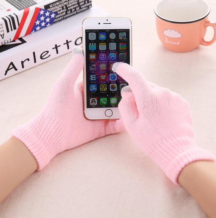 Pink Fleece-Lined Suede Winter Gloves worn using a phone