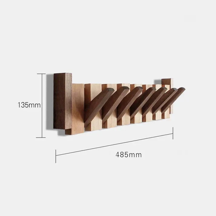 Folding wooden coat rack holding bags and a hat