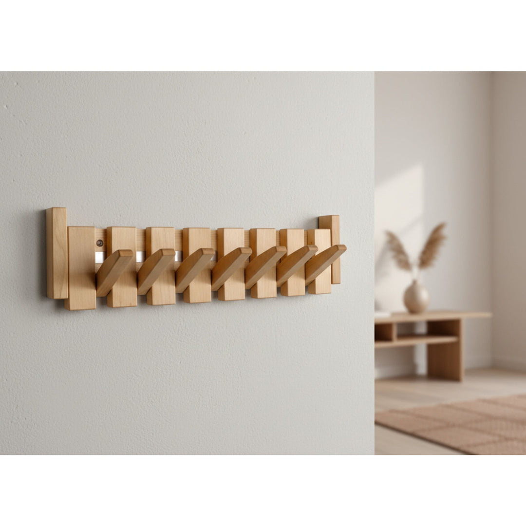 Light wood folding coat rack mounted in a hallway