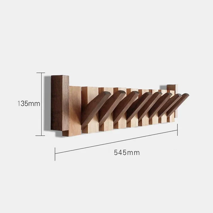 Folding wooden coat rack mounted in an entryway