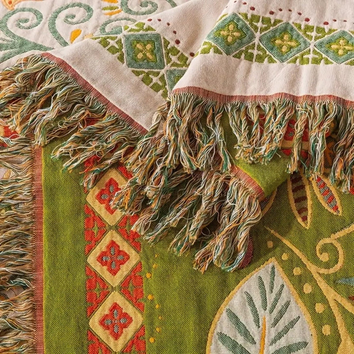 Folk art print cotton gauze throw blanket on sofa