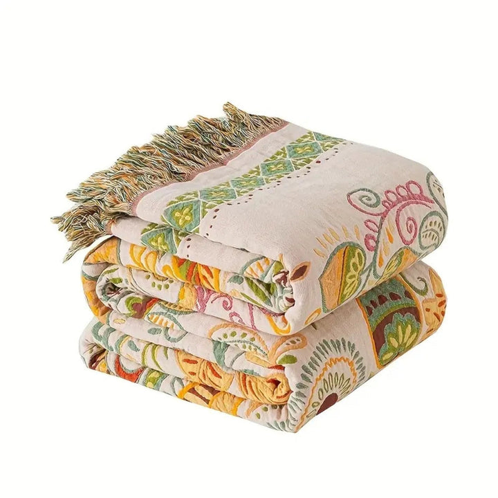 Folk art print cotton gauze throw blanket on bed