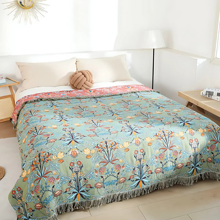 Fringed Floral Cotton Bedspread Throw covering a bed