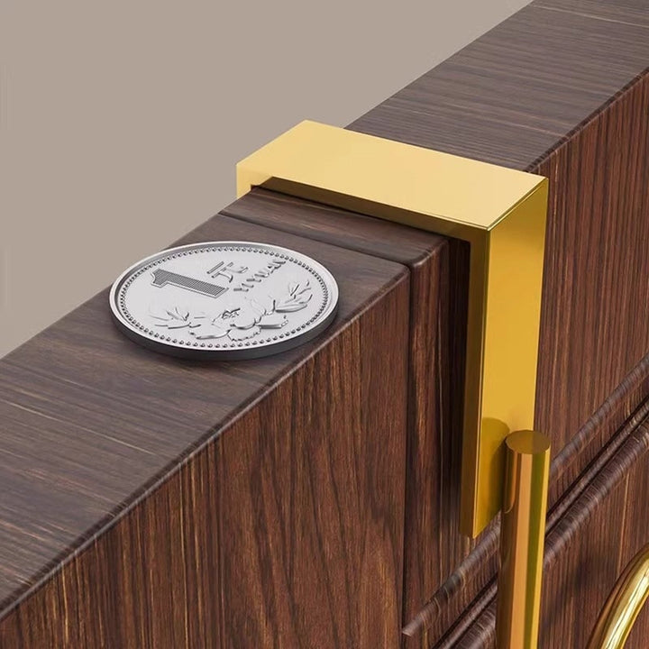Gold over-door coat hook rack clamp detail on a door frame