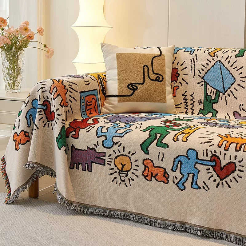 Multicolor Graffiti Pop Art Woven Throw Blanket on couch