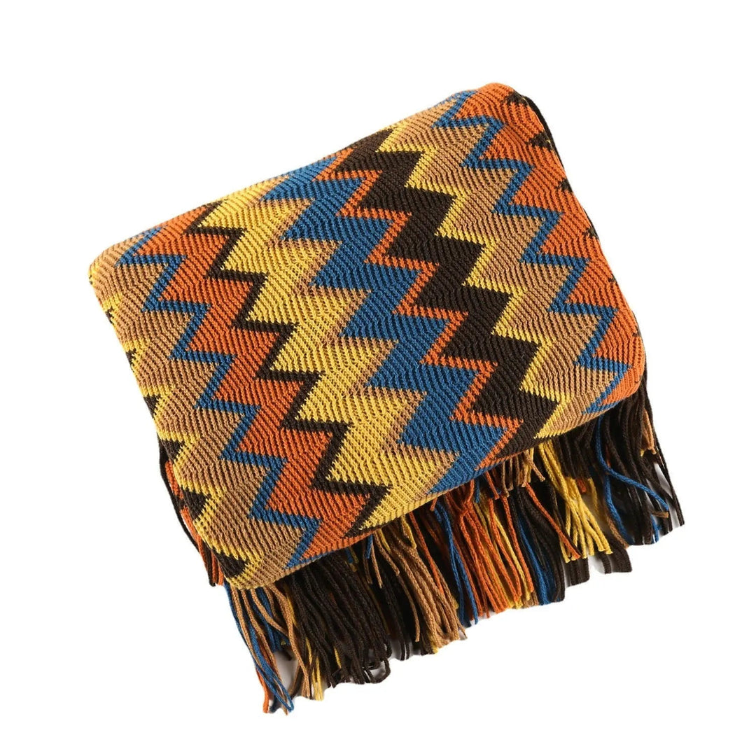 Multicolor Hand-Knit Chevron Throw Blanket folded with tassels