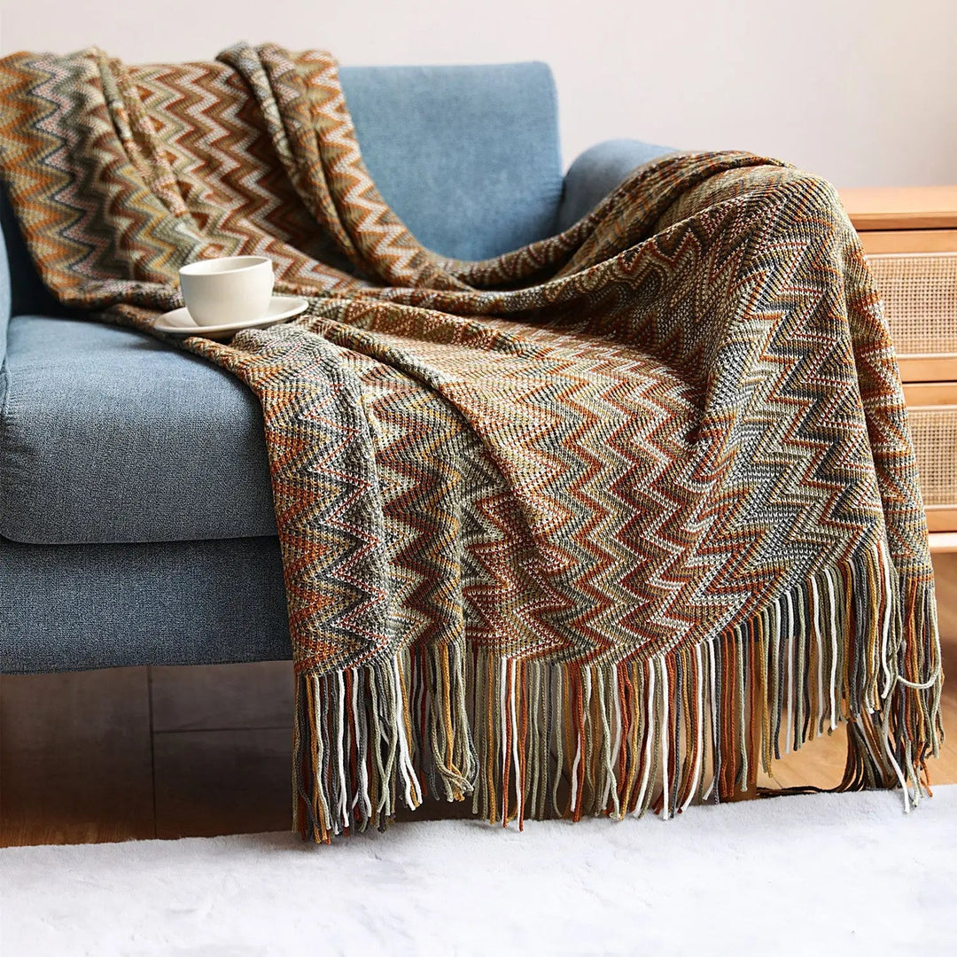 Bamboo Hand-Knit Chevron Throw Blanket draped on sofa