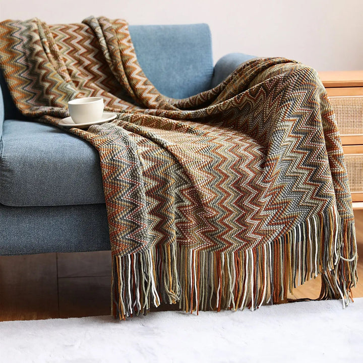 Bamboo Hand-Knit Chevron Throw Blanket draped on sofa