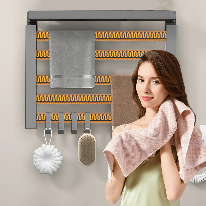 Gray heated towel rack in use in a bathroom