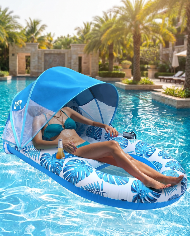 Blue leaf-print Canopy Pool Lounge Float floating in resort pool