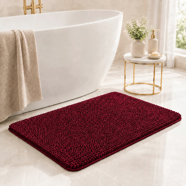 Dark Red Kaelis Plush Chenille Bath Mat in bathroom by tub
