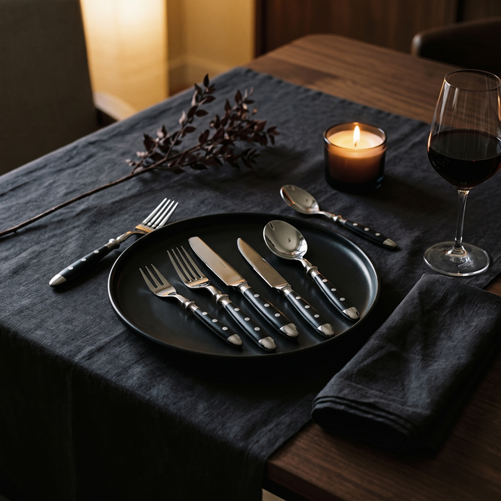 Elegant Black Stainless Steel Cutlery Set styled on an elegant modern dinner table