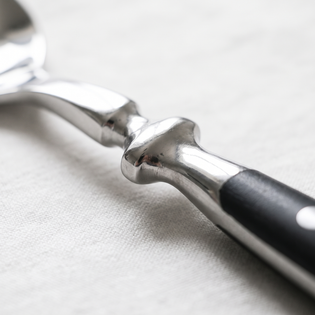 Elegant Black Stainless Steel Cutlery neck and joint macro detail